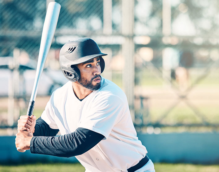 Marion Park athletic programs league with a baseball player ready to swing a bat